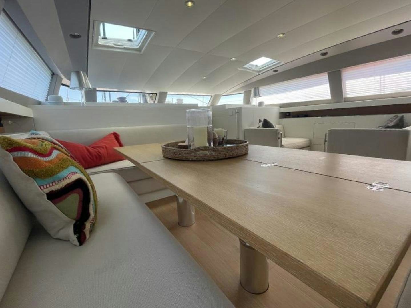 a room with a bed and a table aboard KESTREL Yacht for Sale