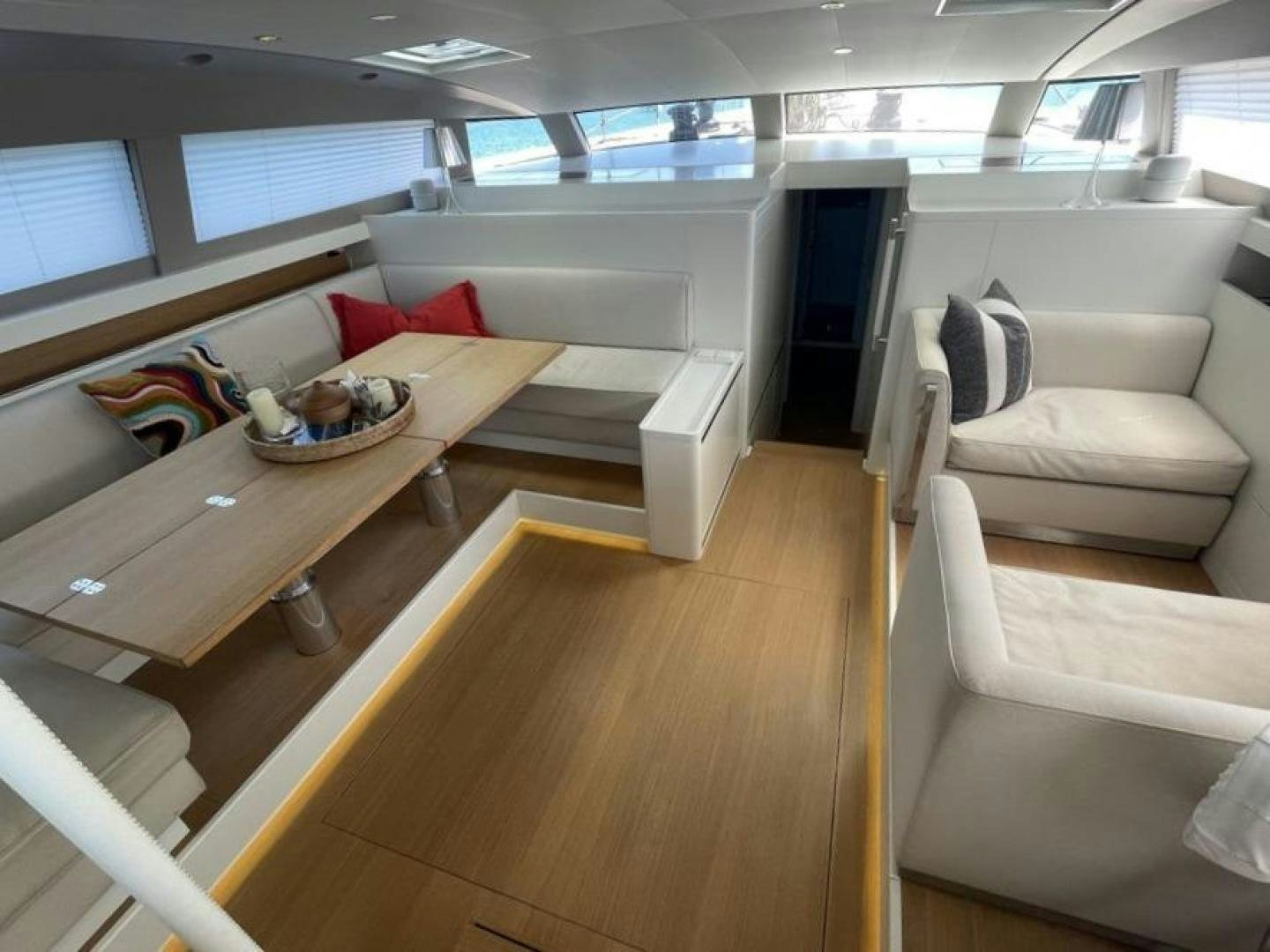 a living room with a wood floor aboard KESTREL Yacht for Sale
