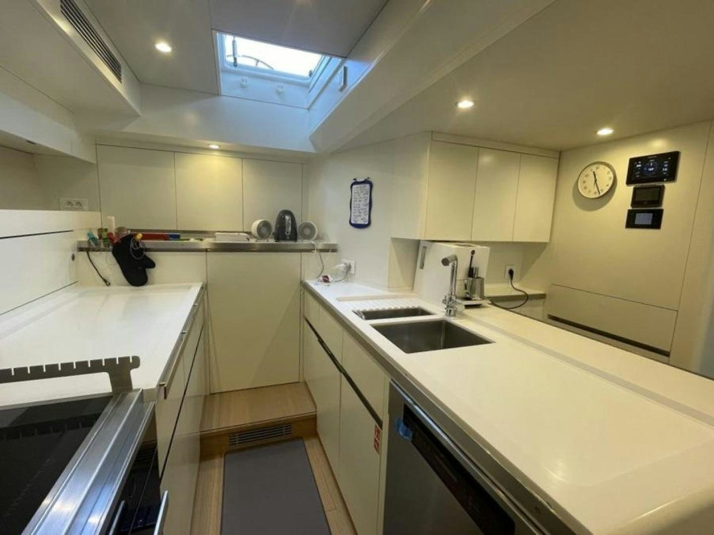 a kitchen with a sink and a stove aboard KESTREL Yacht for Sale