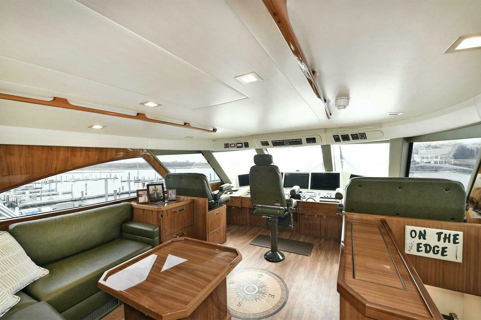 a room with a couch and a table and a chair aboard ON THE EDGE Yacht for Sale