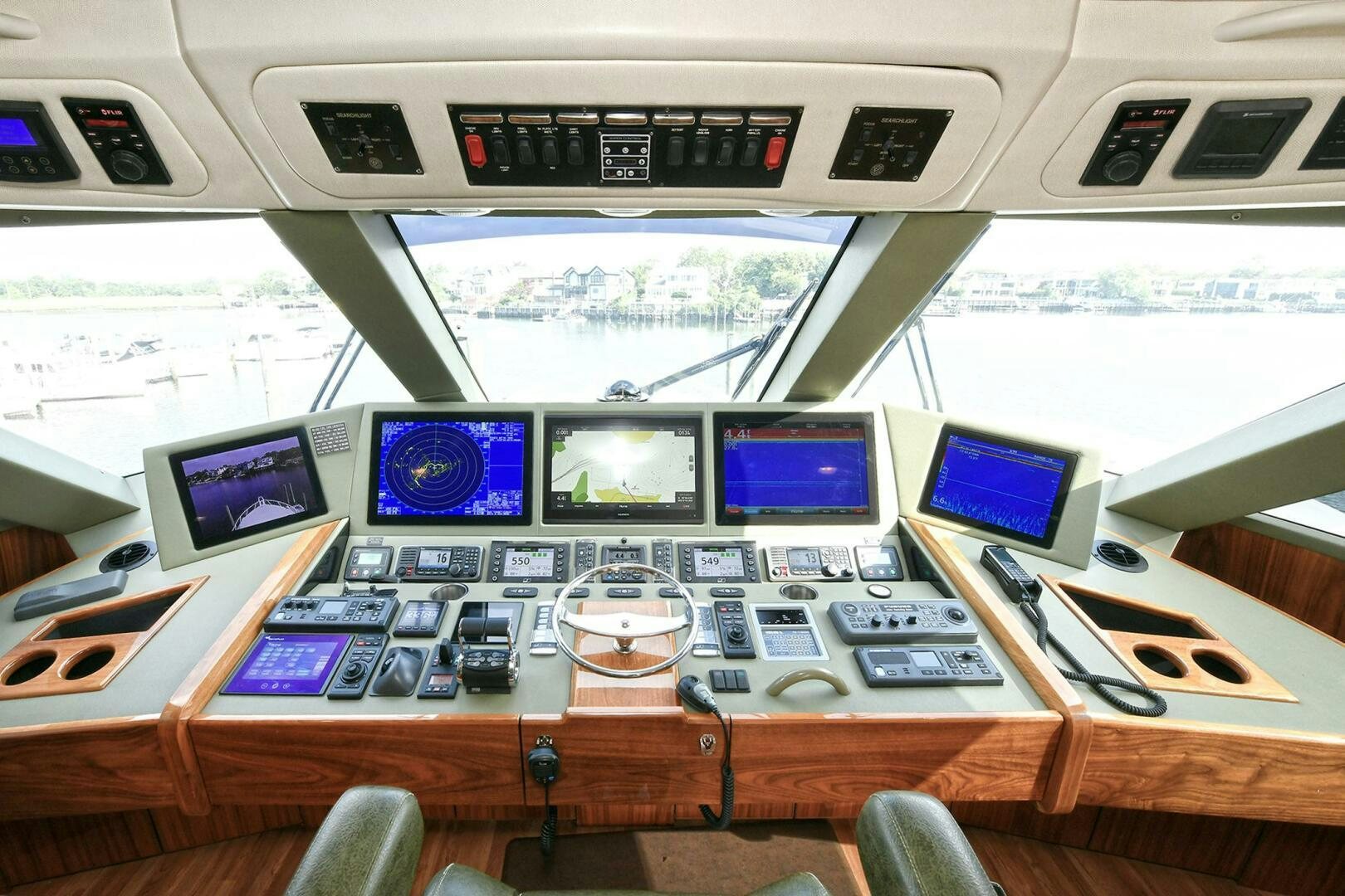 a control panel with many monitors aboard ON THE EDGE Yacht for Sale
