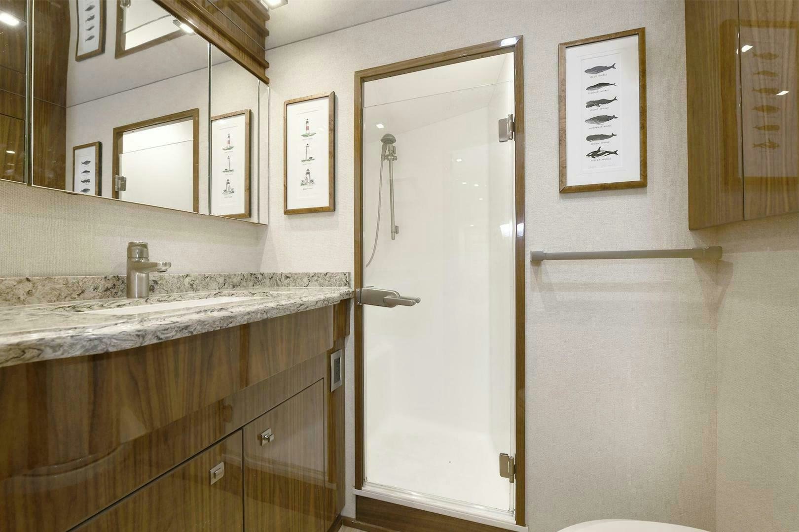 a bathroom with a large shower aboard ON THE EDGE Yacht for Sale