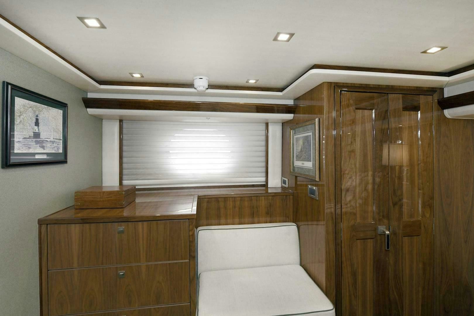 a room with a couch and a television aboard ON THE EDGE Yacht for Sale