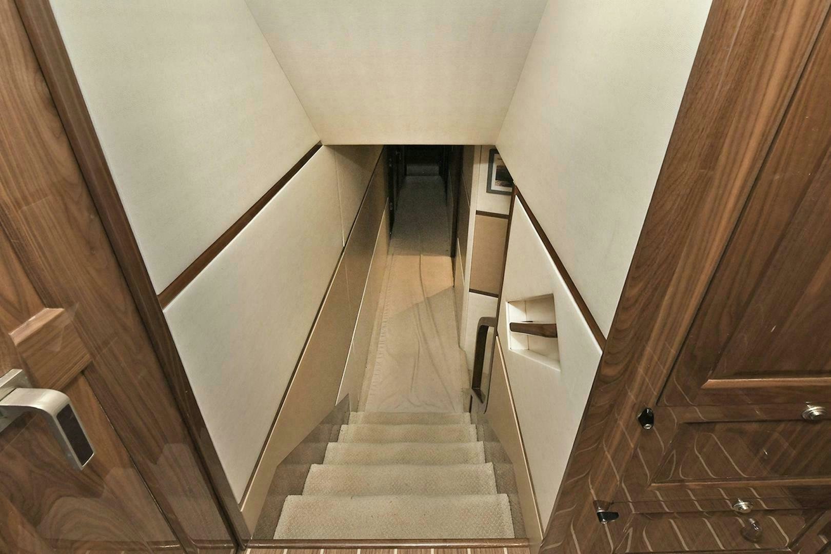 a hallway with white walls aboard ON THE EDGE Yacht for Sale