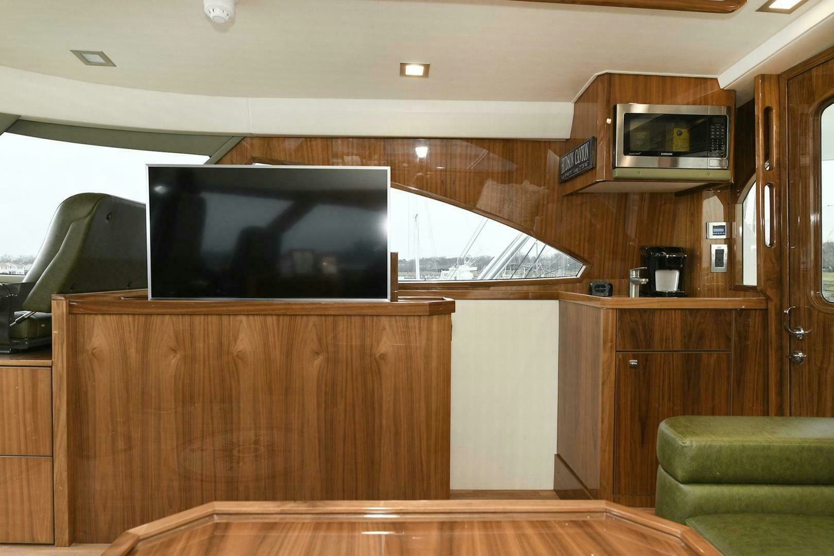 a tv on a cabinet aboard ON THE EDGE Yacht for Sale