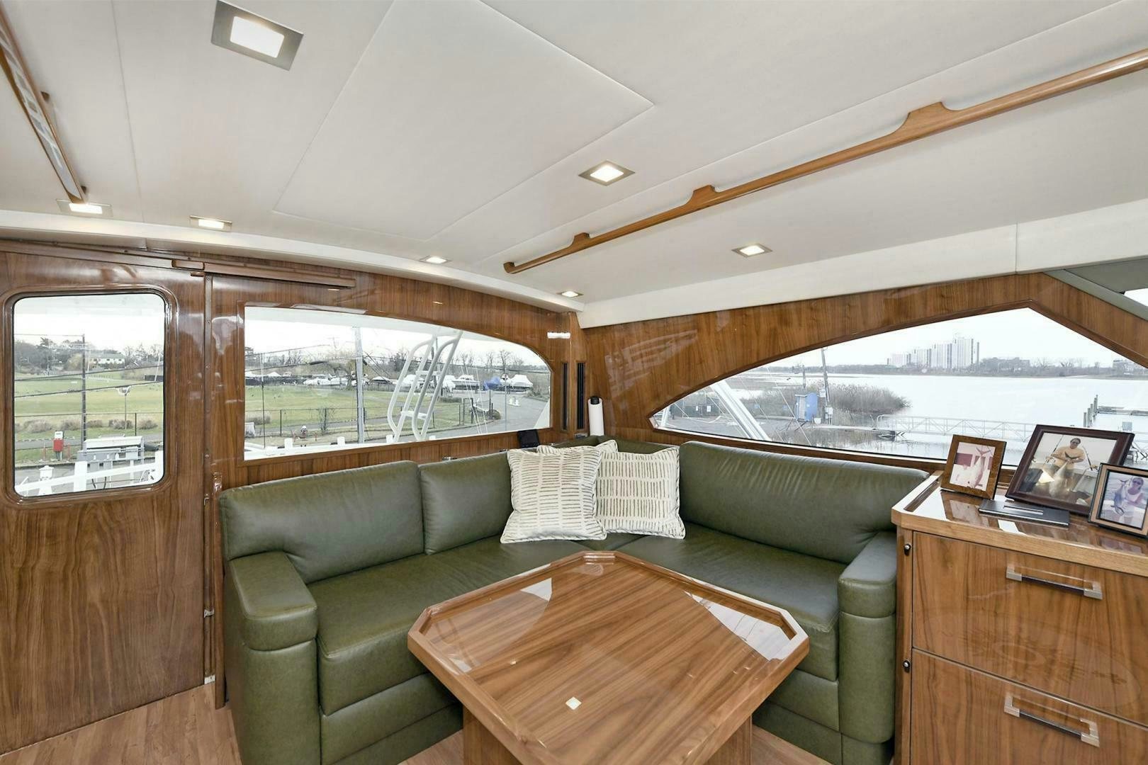 a living room with a couch and a table aboard ON THE EDGE Yacht for Sale