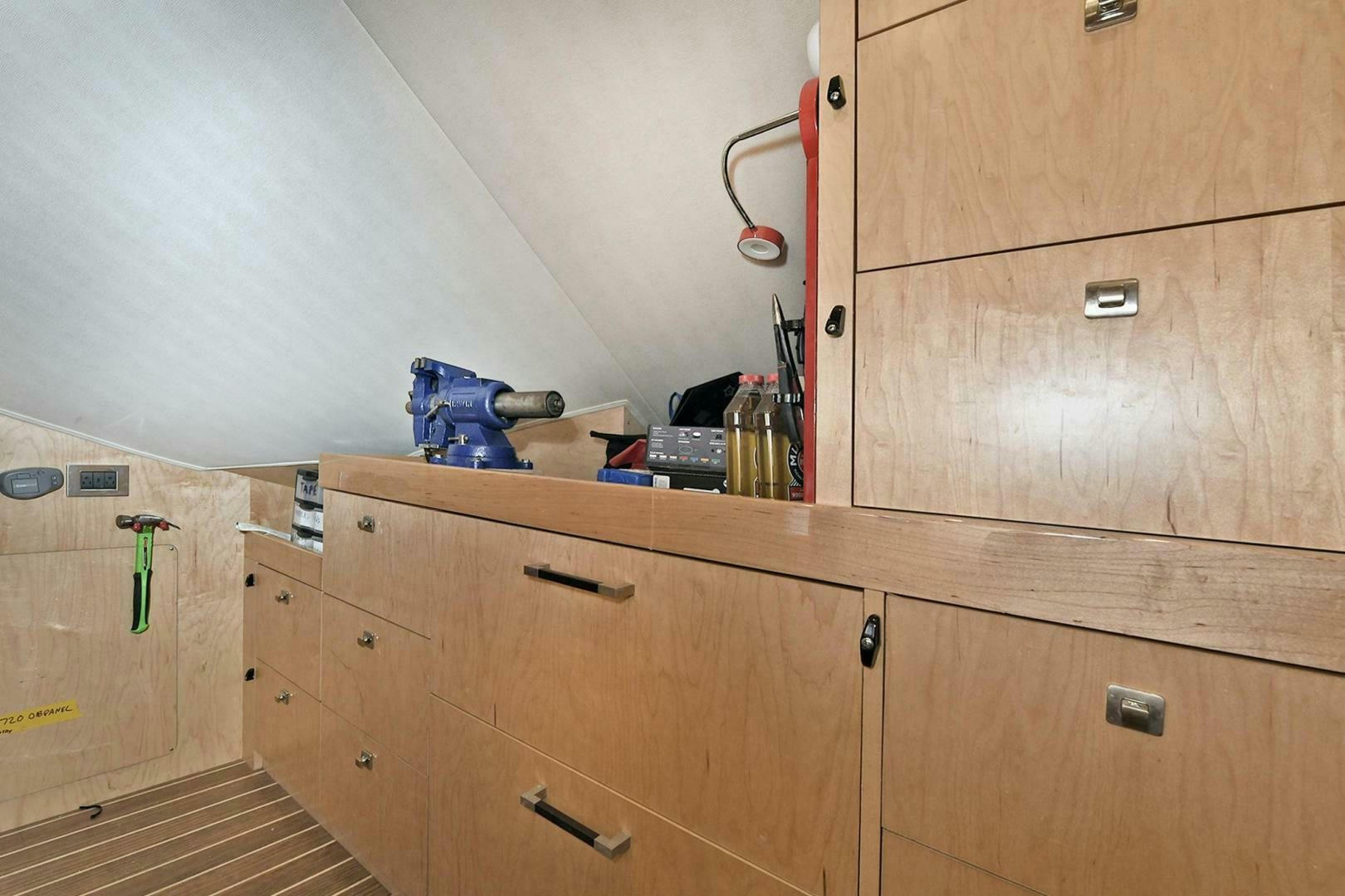 a wooden cabinet with drawers aboard ON THE EDGE Yacht for Sale