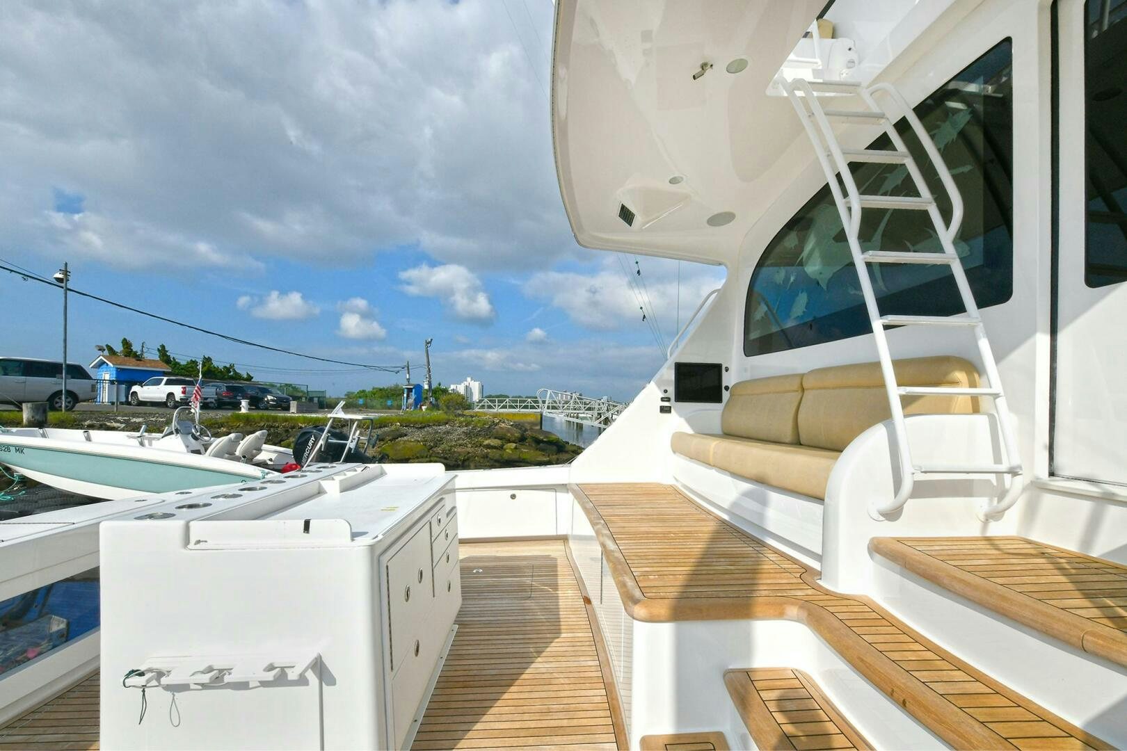 a deck with a view of the water and a boat aboard ON THE EDGE Yacht for Sale