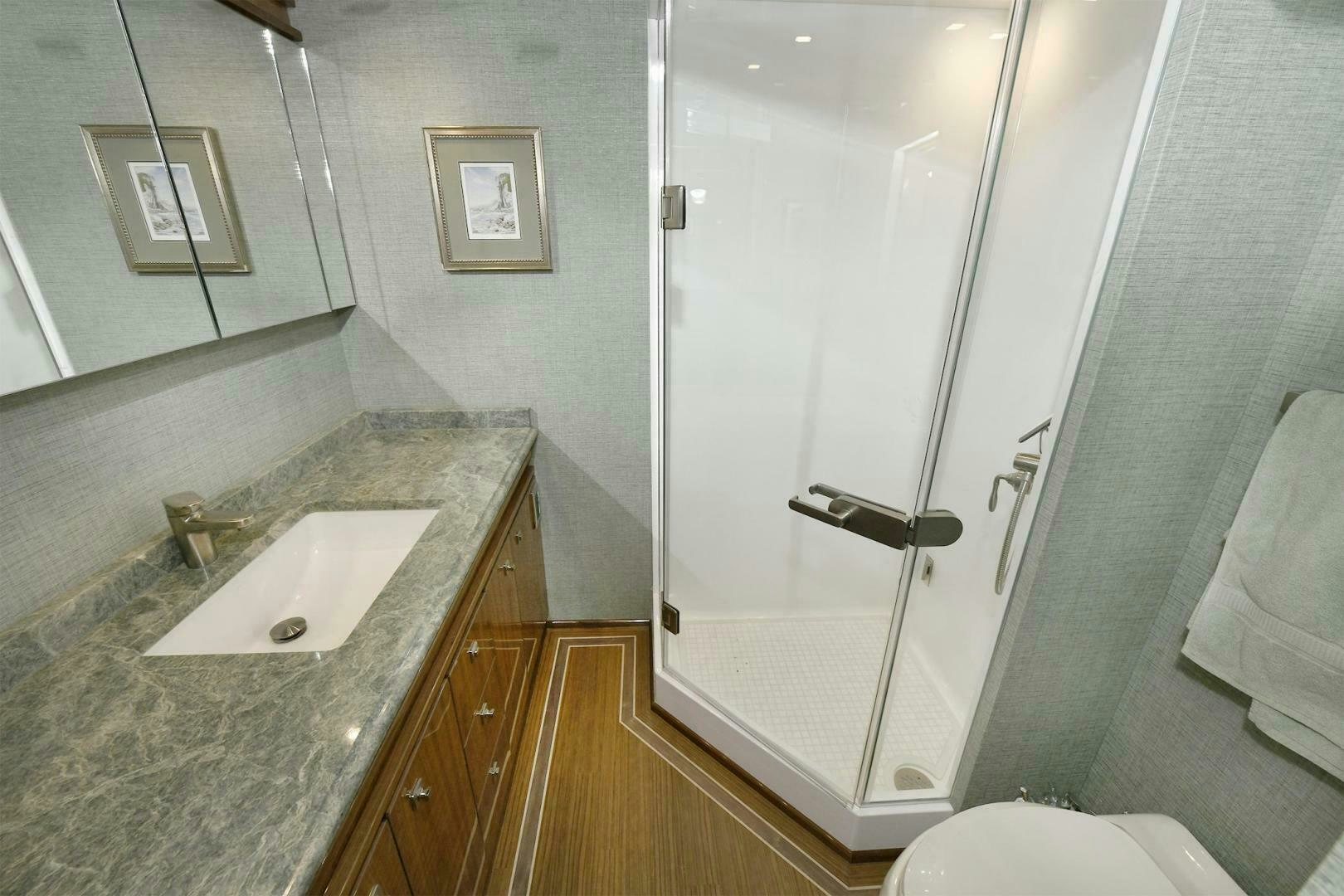 a bathroom with a marble counter top aboard ON THE EDGE Yacht for Sale