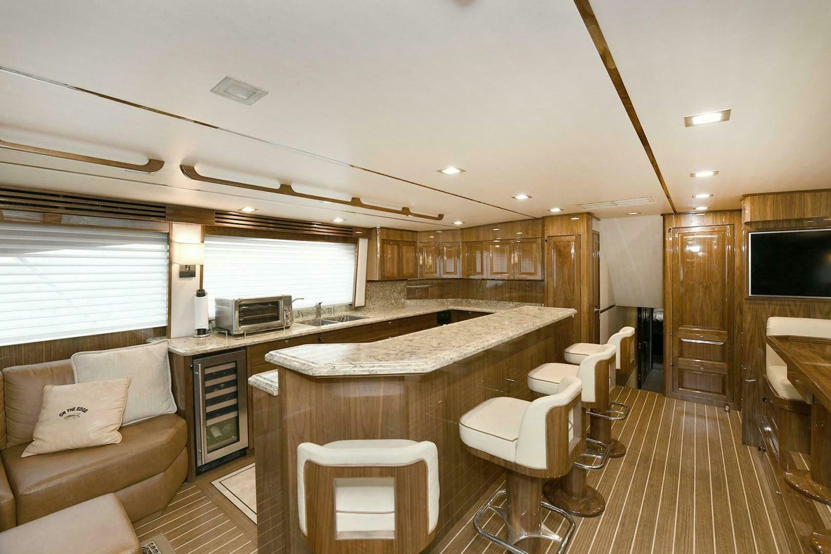 a kitchen with a large island aboard ON THE EDGE Yacht for Sale