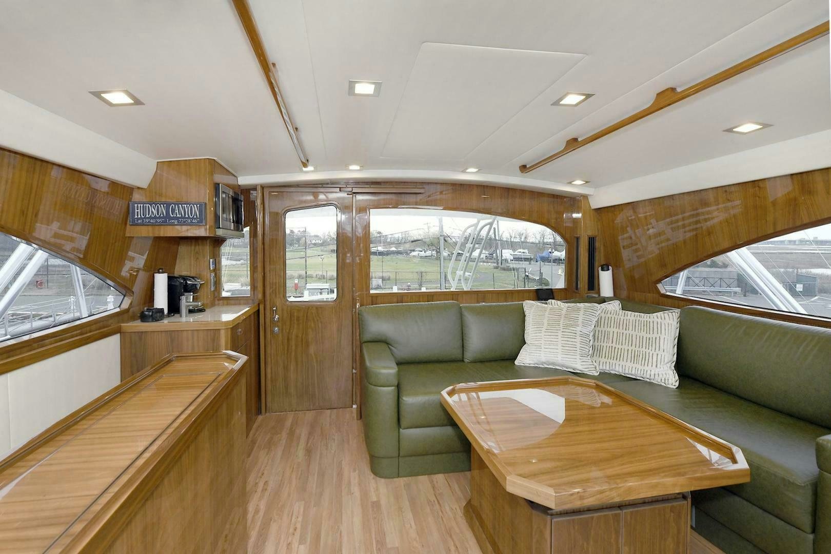 a living room with a couch and a table aboard ON THE EDGE Yacht for Sale