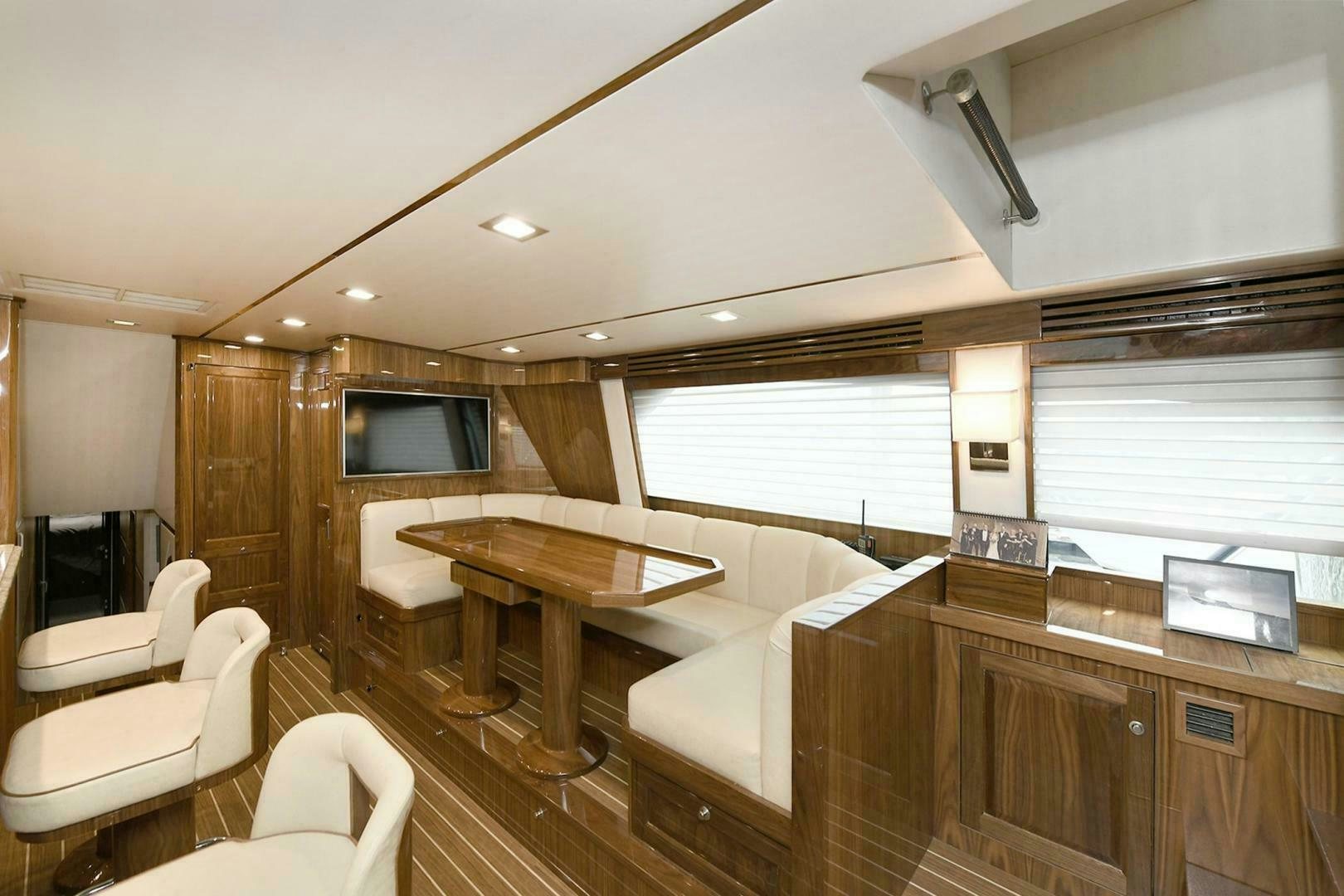 a room with a table and chairs aboard ON THE EDGE Yacht for Sale