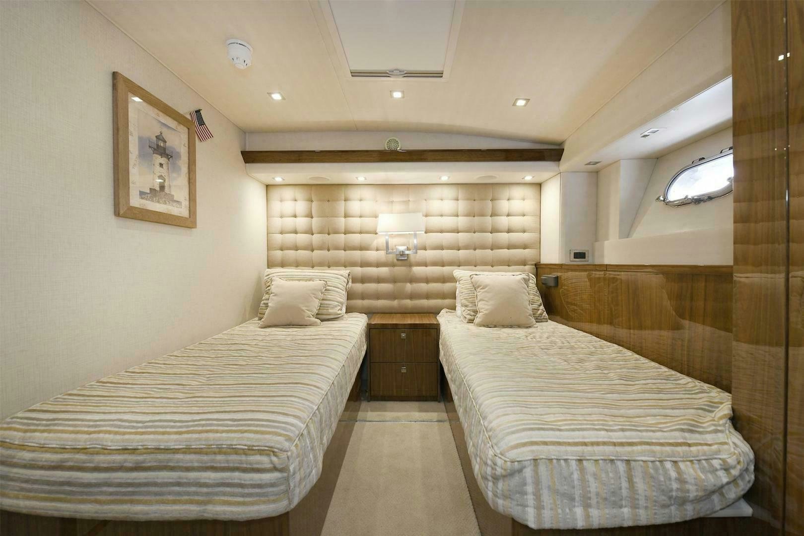 a room with two beds aboard ON THE EDGE Yacht for Sale