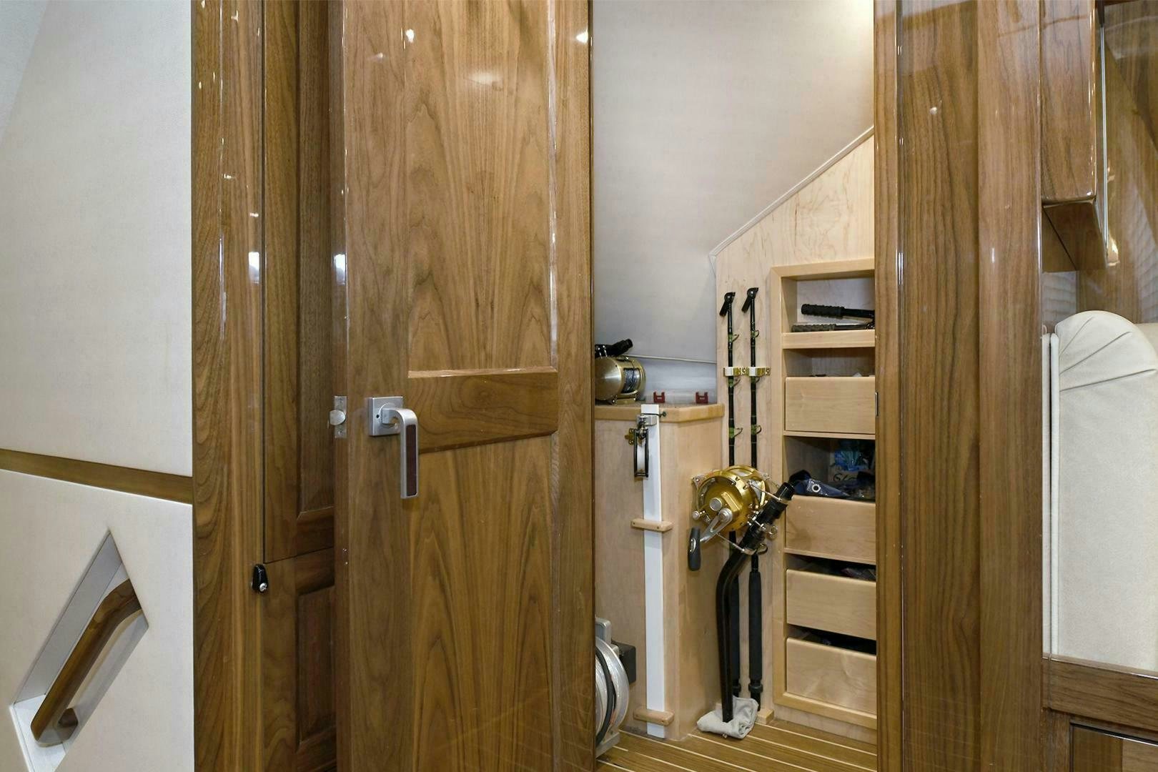 a room with wooden doors aboard ON THE EDGE Yacht for Sale