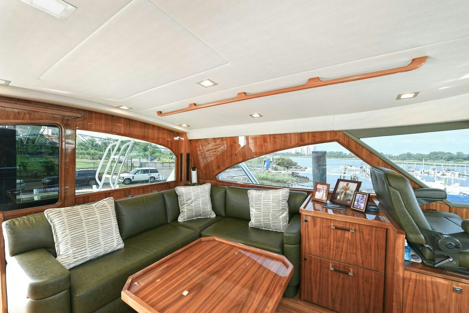 a living room with a couch and a table aboard ON THE EDGE Yacht for Sale