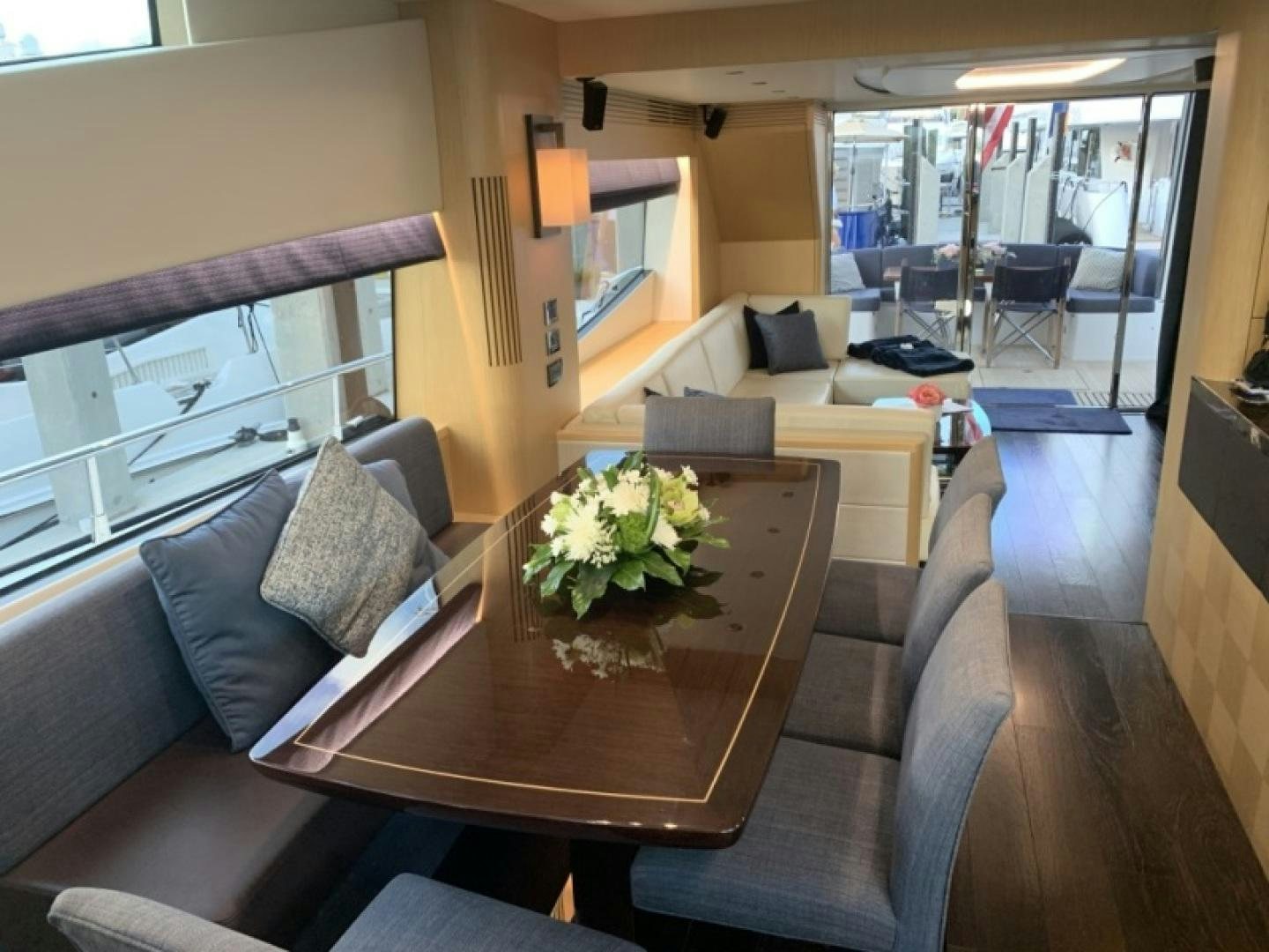 a living room with a table and chairs aboard NBLUE Yacht for Sale