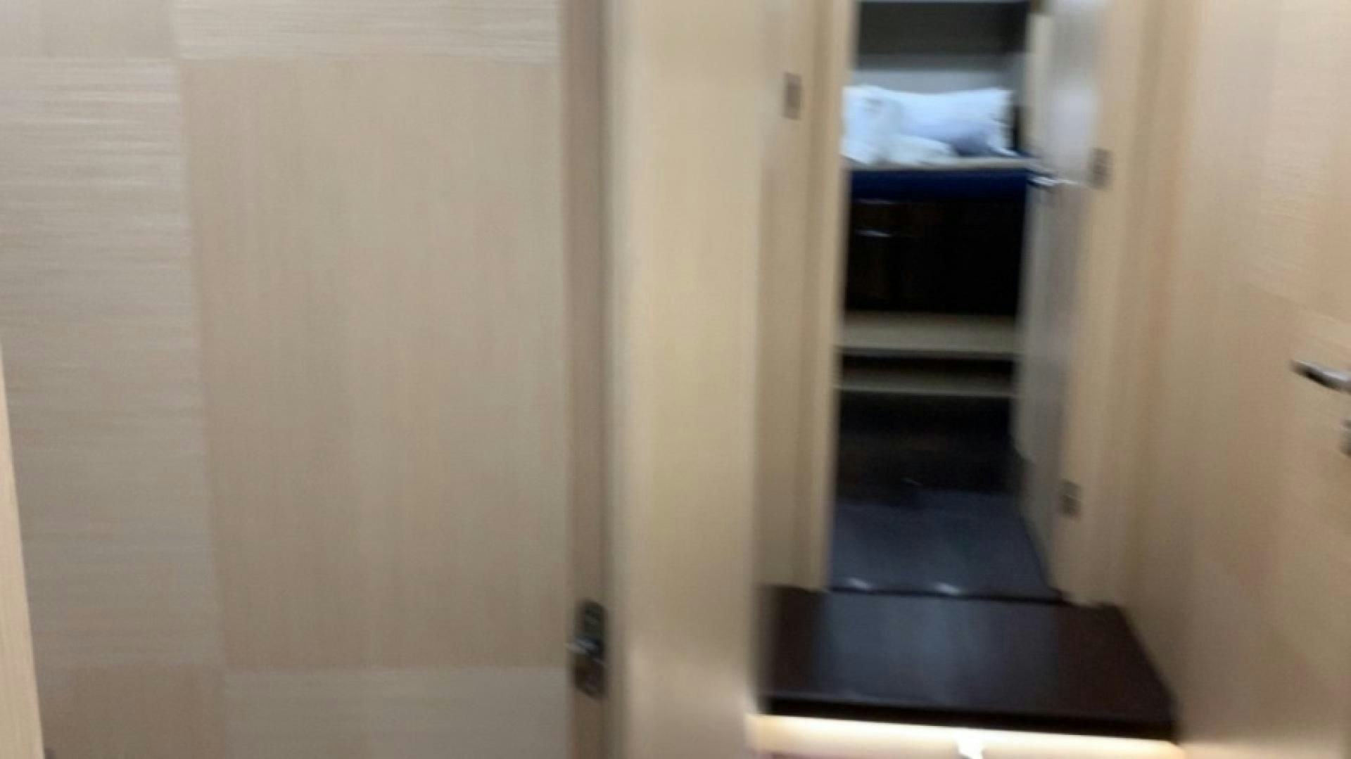 a hallway with a black door aboard NBLUE Yacht for Sale