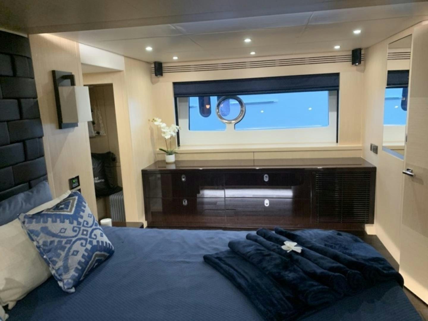 a bedroom with a large tv aboard NBLUE Yacht for Sale