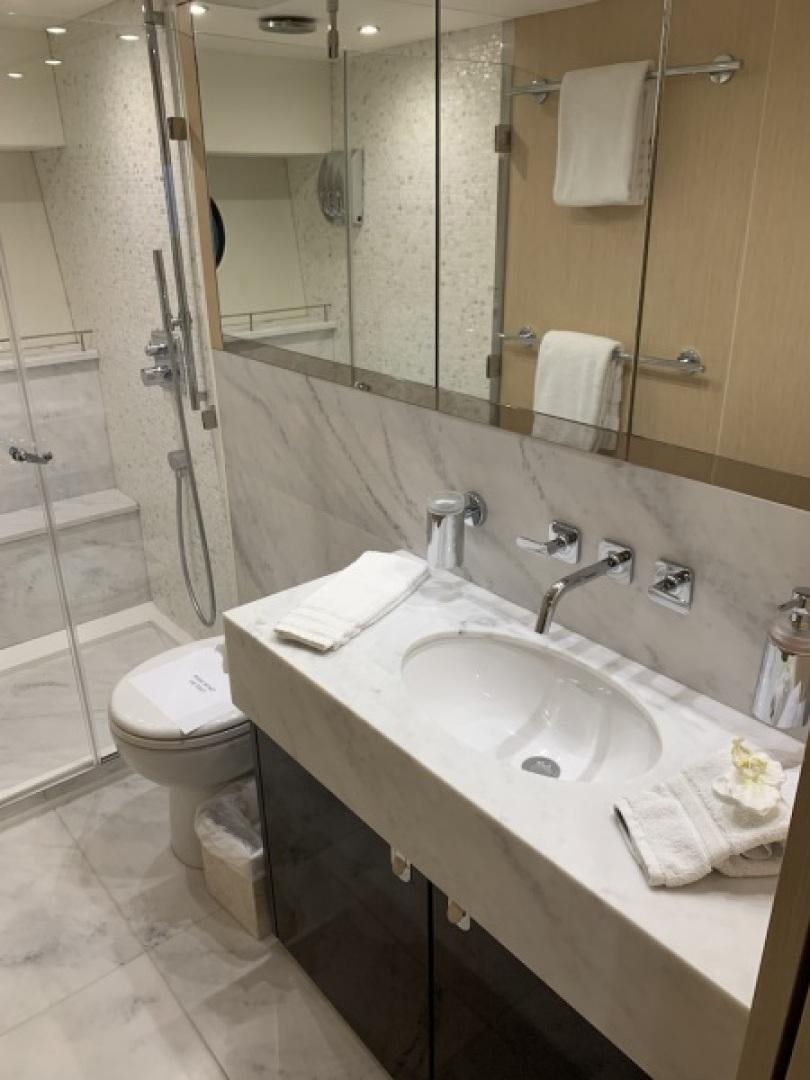 a bathroom with a sink and a toilet aboard NBLUE Yacht for Sale