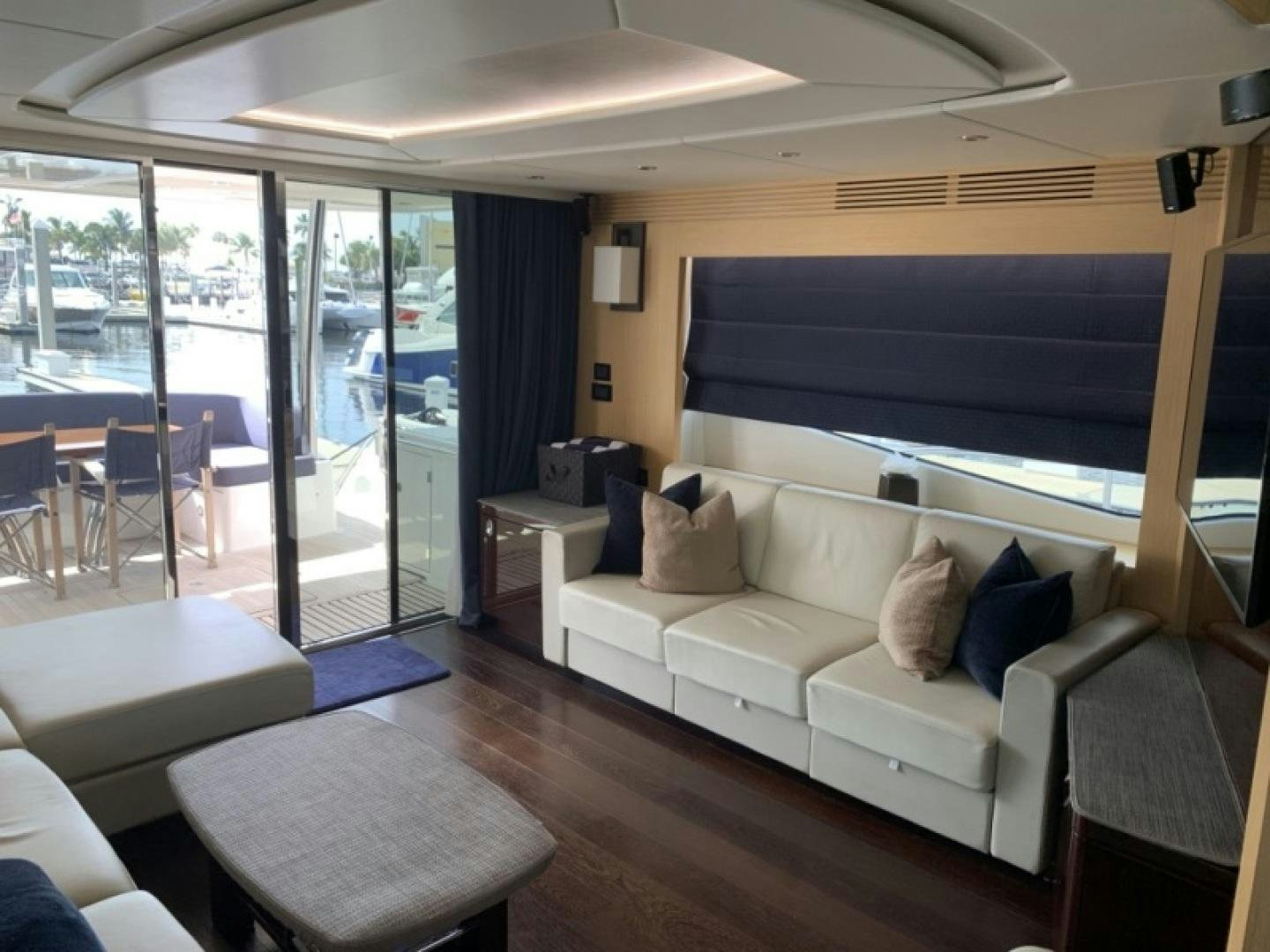 a living room with a large screen aboard NBLUE Yacht for Sale