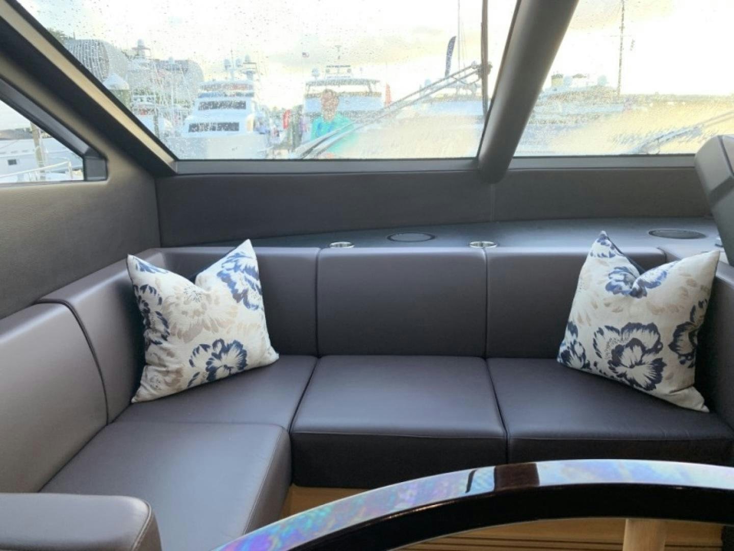 a couch with pillows aboard NBLUE Yacht for Sale