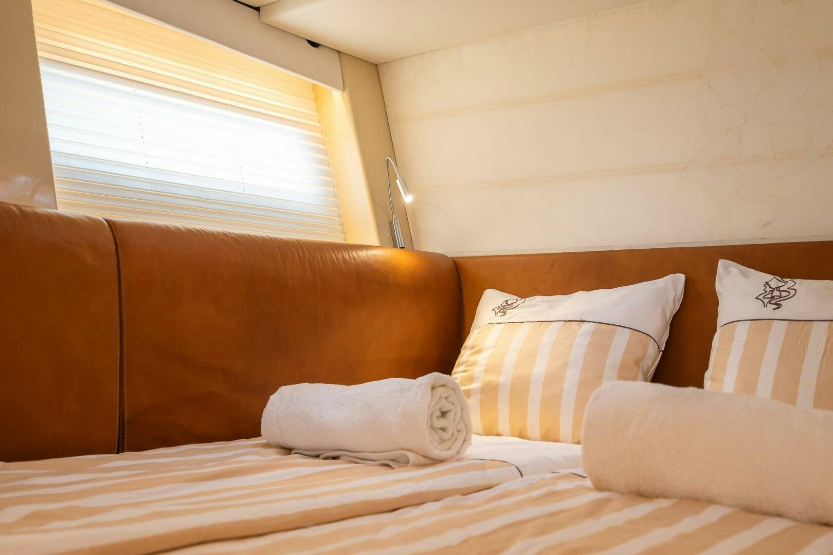 a bed with pillows aboard BLISS II Yacht for Sale