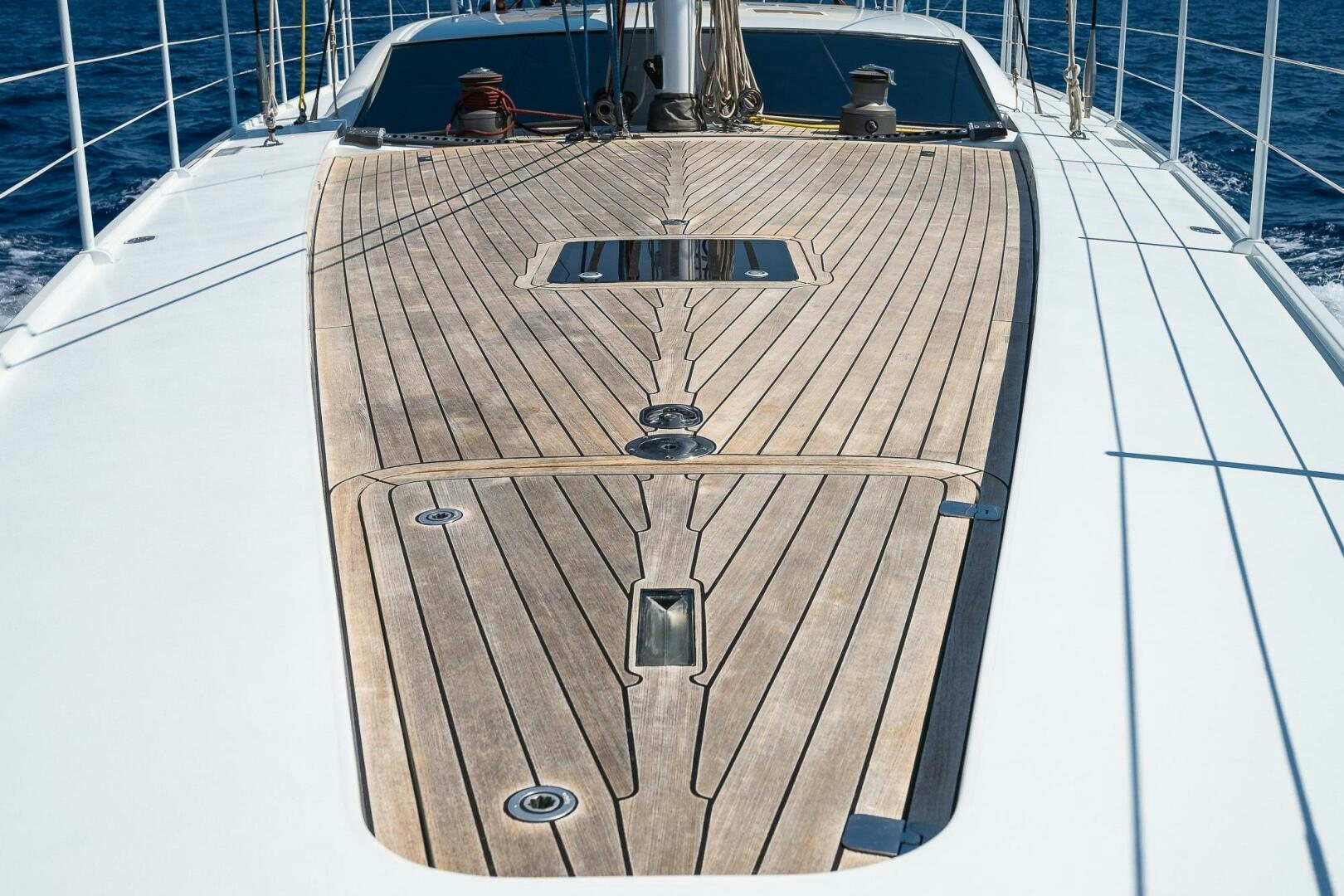 a wooden boat on a deck aboard BLISS II Yacht for Sale