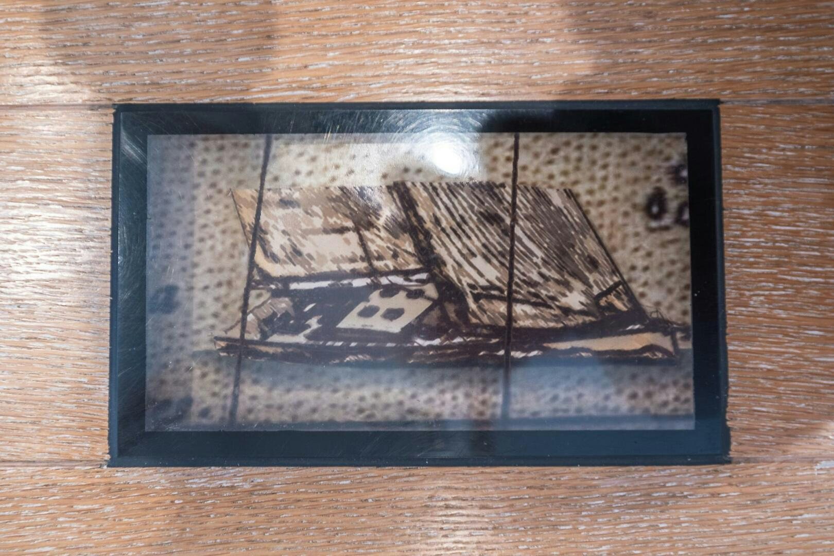 a framed picture of a ship aboard BLISS II Yacht for Sale