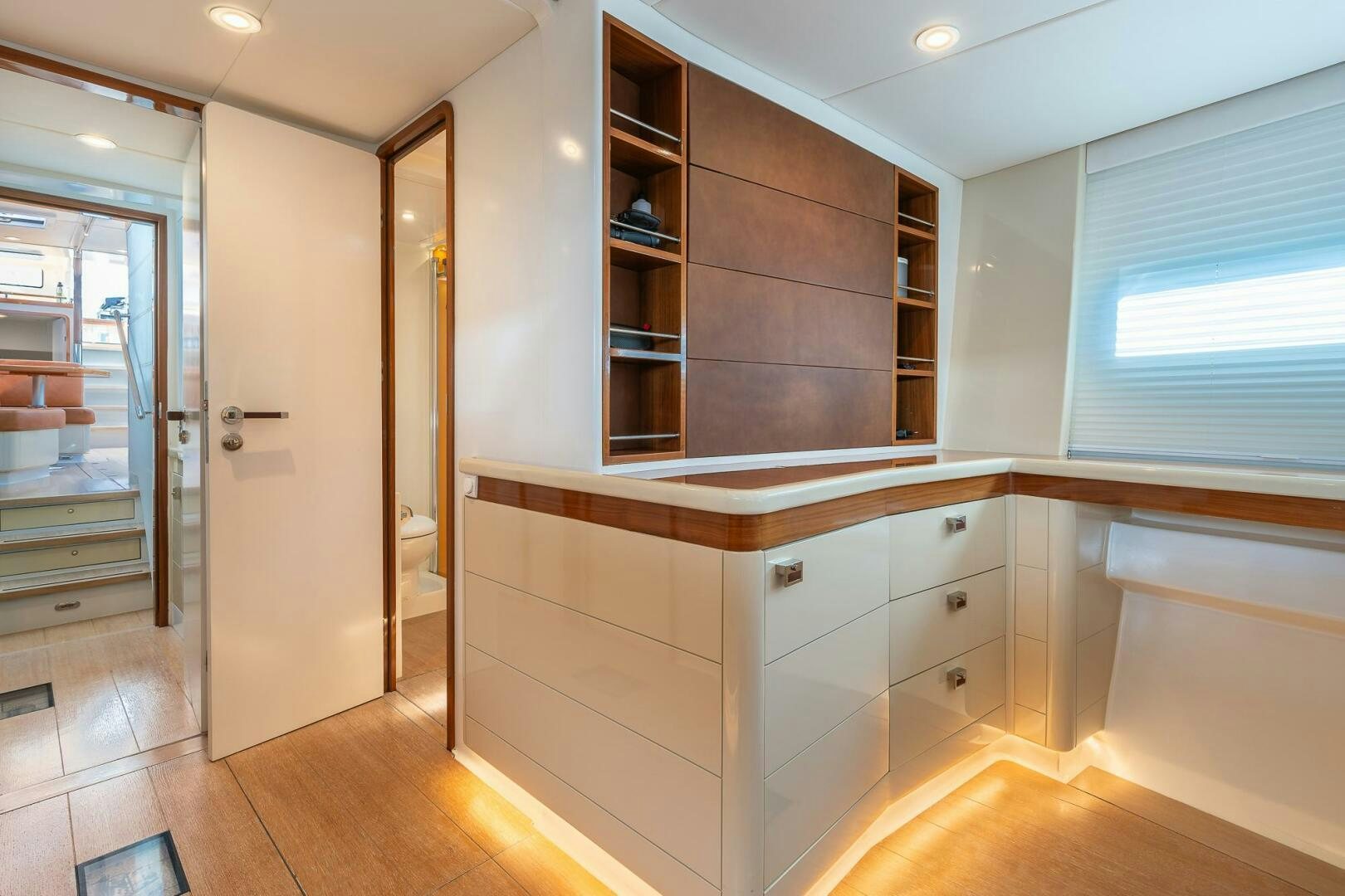 a room with a wood cabinet and a mirror aboard BLISS II Yacht for Sale