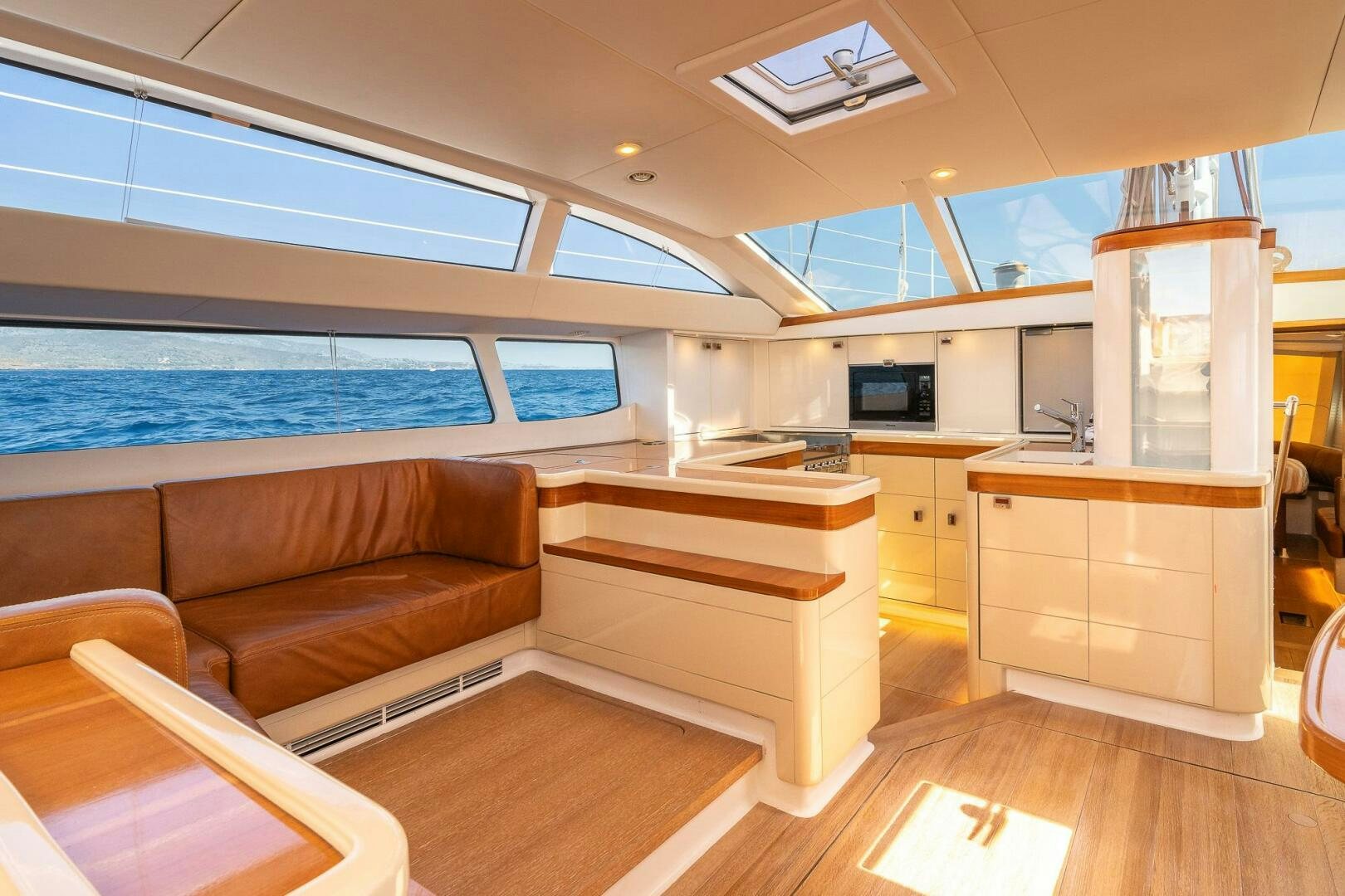 a room with a couch and a television aboard BLISS II Yacht for Sale