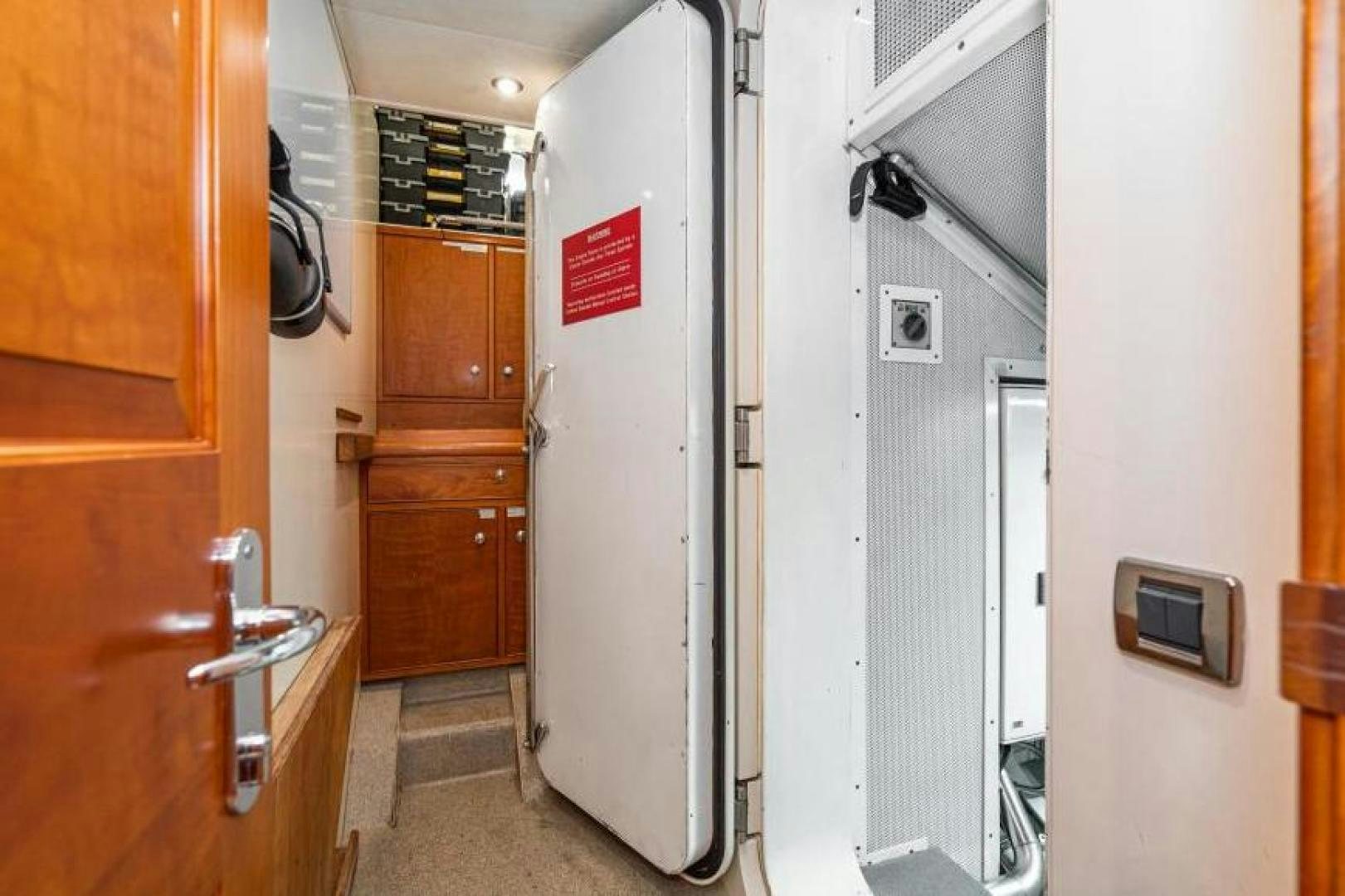a room with wooden cabinets aboard PALIADOR Yacht for Sale