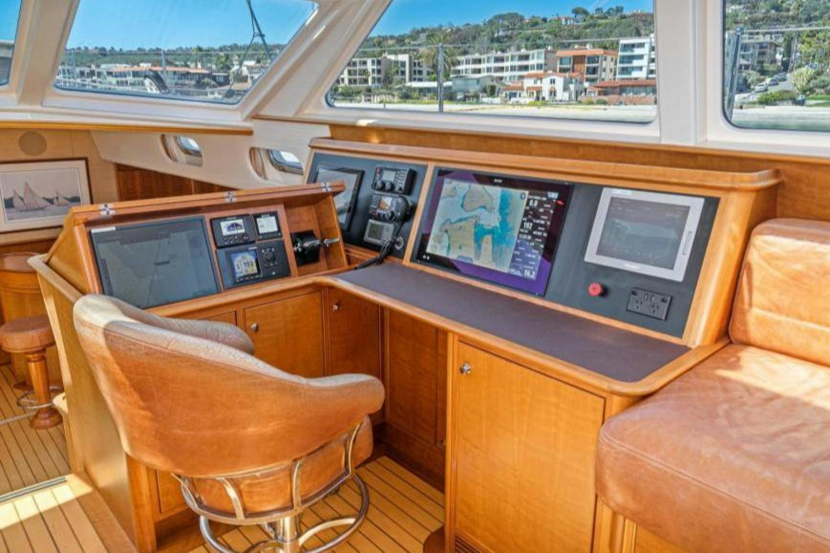 a room with a couch and a tv aboard PALIADOR Yacht for Sale
