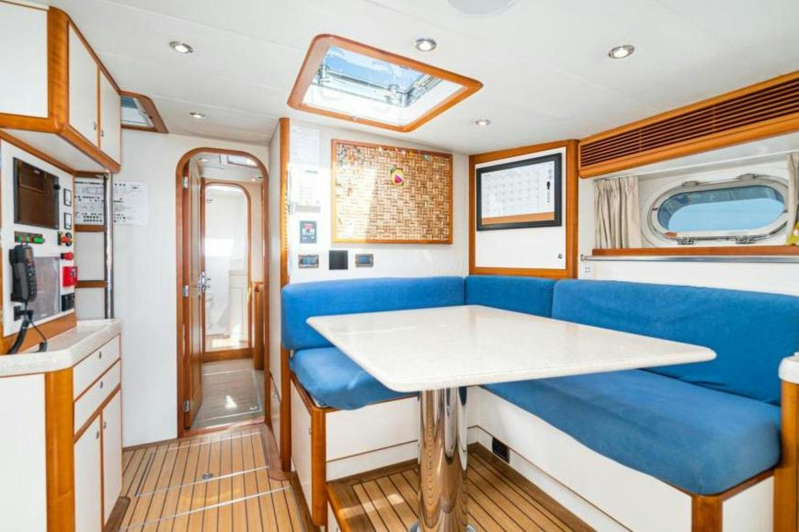 a room with a table and chairs aboard PALIADOR Yacht for Sale
