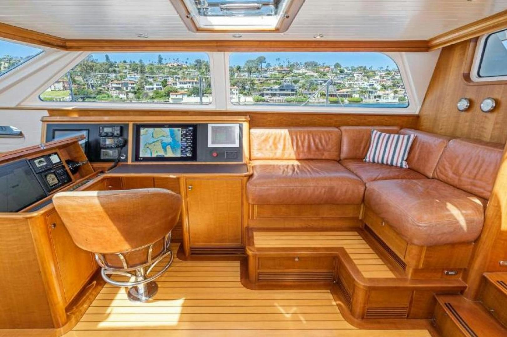 a living room with a couch and a table aboard PALIADOR Yacht for Sale