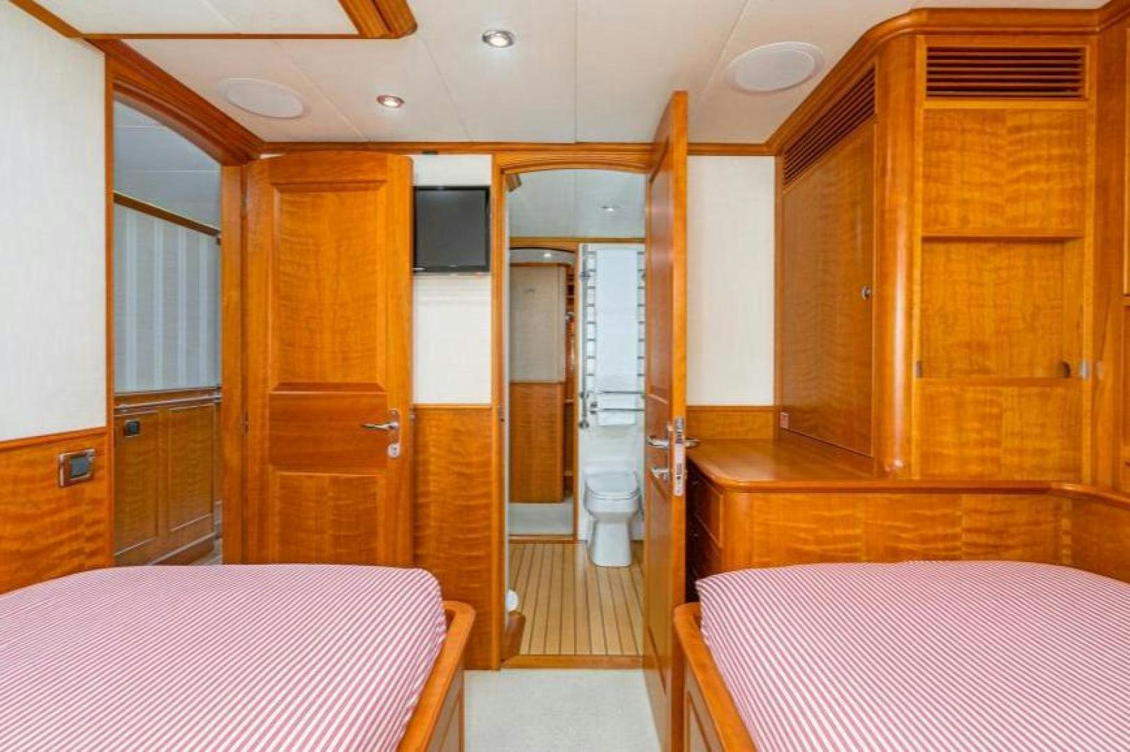 a room with a bed and a closet aboard PALIADOR Yacht for Sale