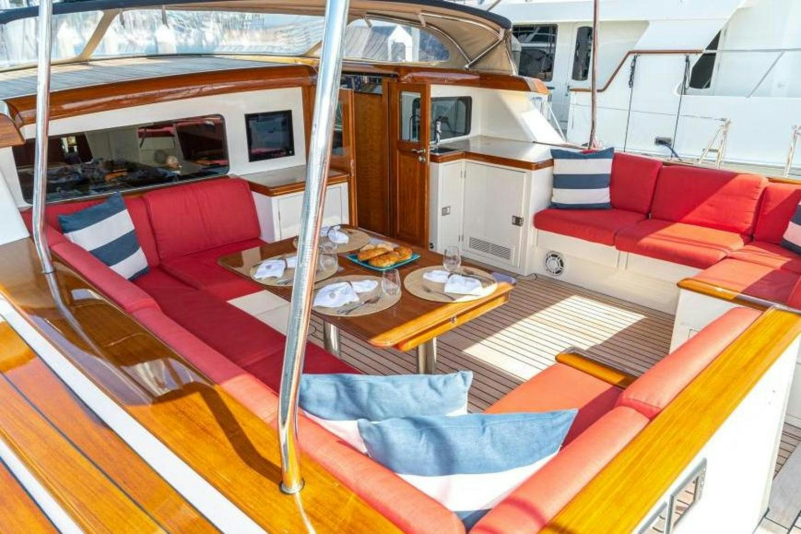 a boat with a deck and a bed aboard PALIADOR Yacht for Sale