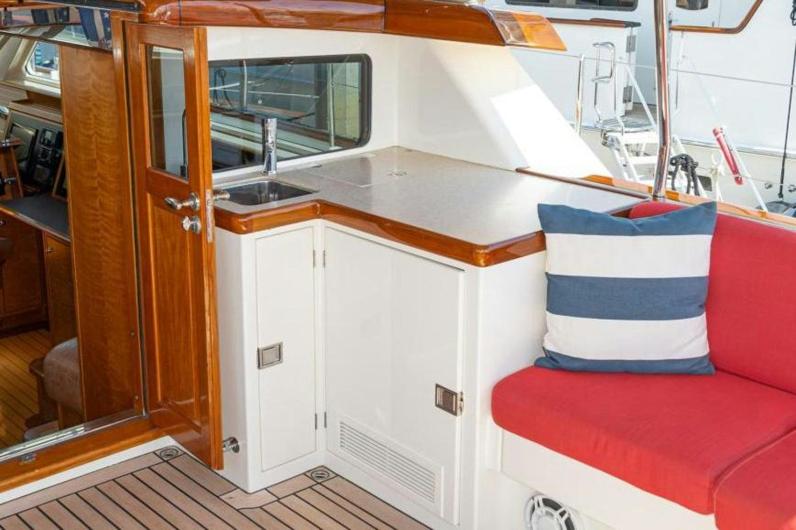 a boat with a red couch aboard PALIADOR Yacht for Sale