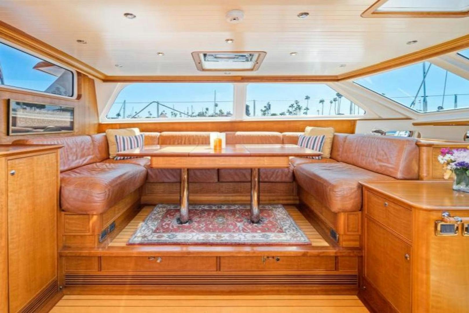 a room with a couch and a table aboard PALIADOR Yacht for Sale