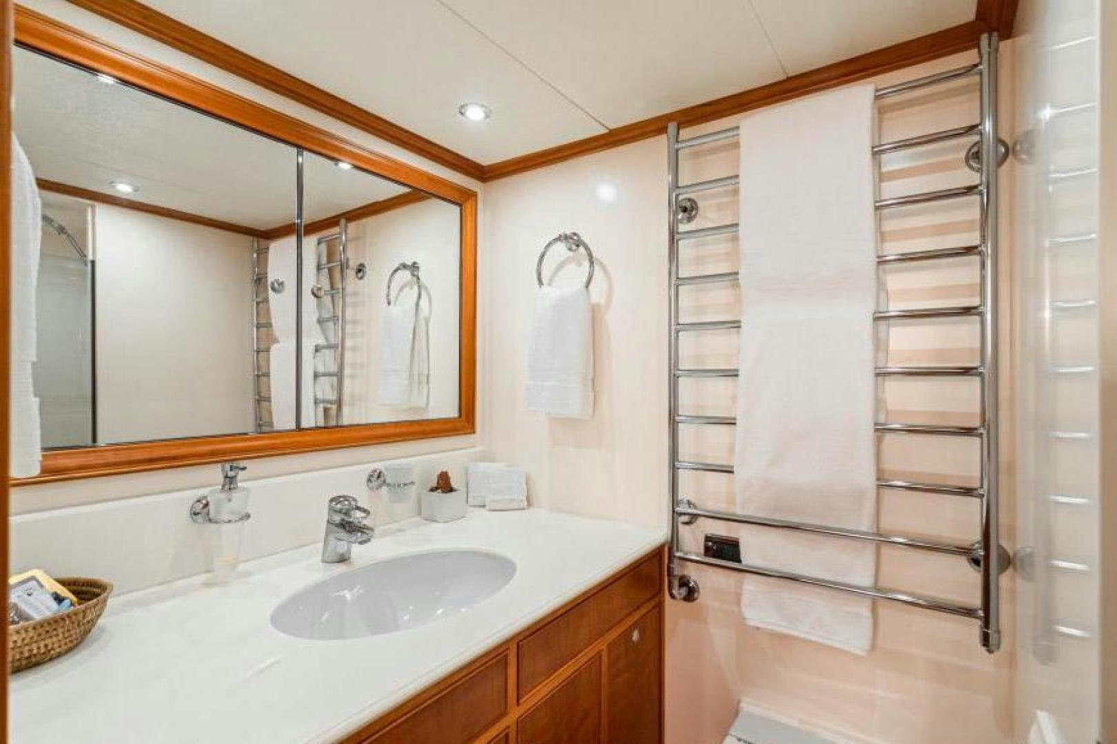 a bathroom with a mirror and a sink aboard PALIADOR Yacht for Sale