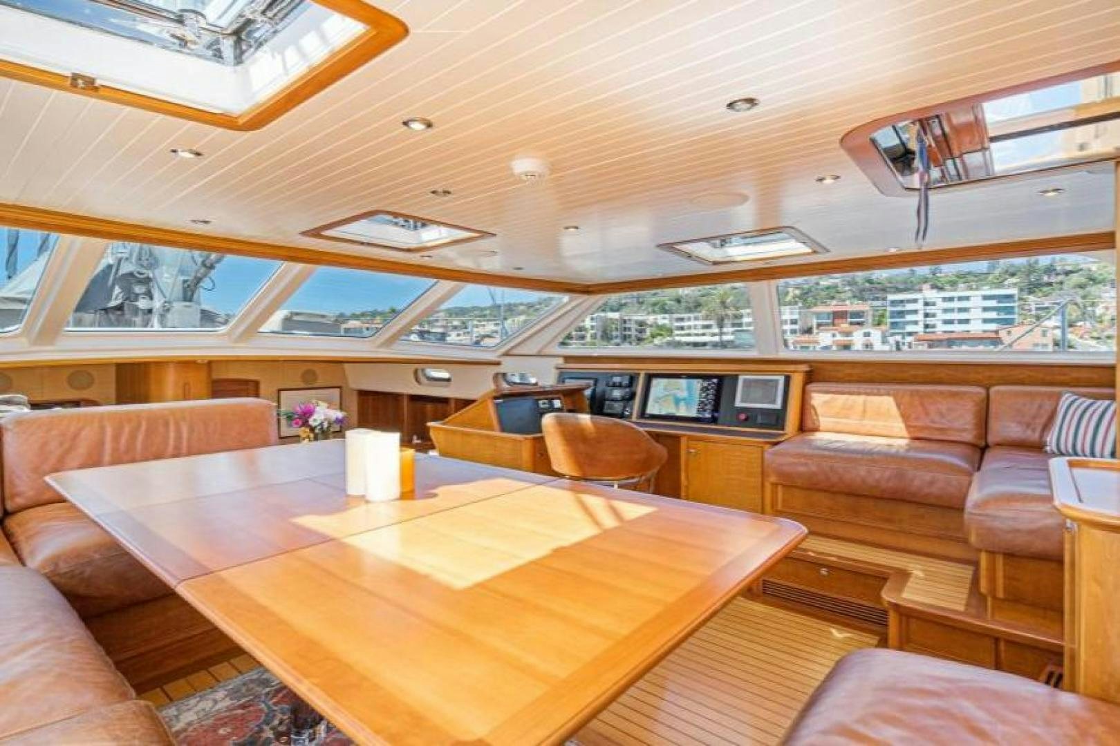 a room with a table and chairs aboard PALIADOR Yacht for Sale