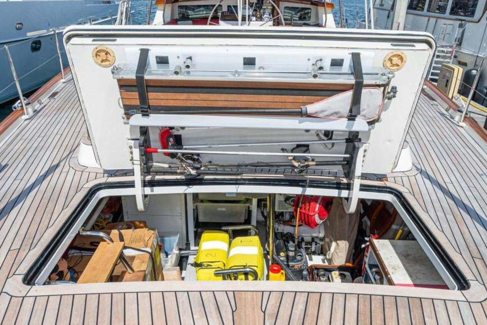 a large white boat with a yellow and black object on it aboard PALIADOR Yacht for Sale