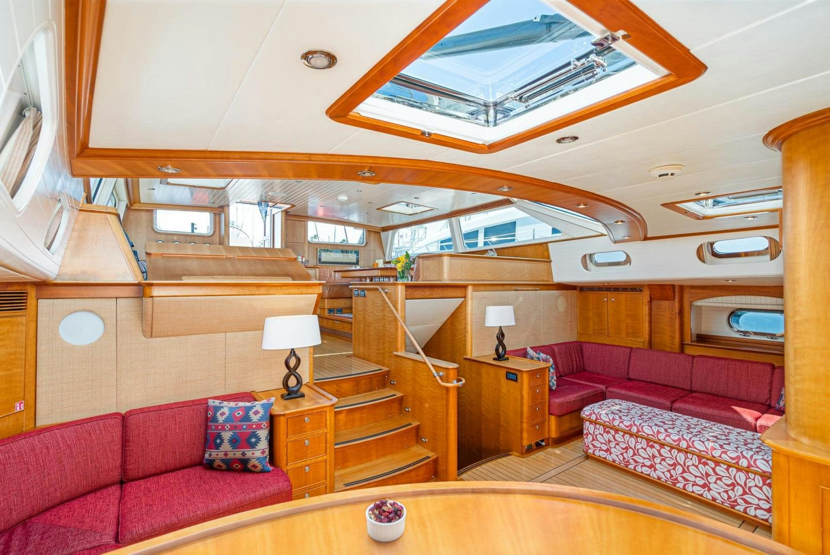 a large living room with a staircase aboard PALIADOR Yacht for Sale