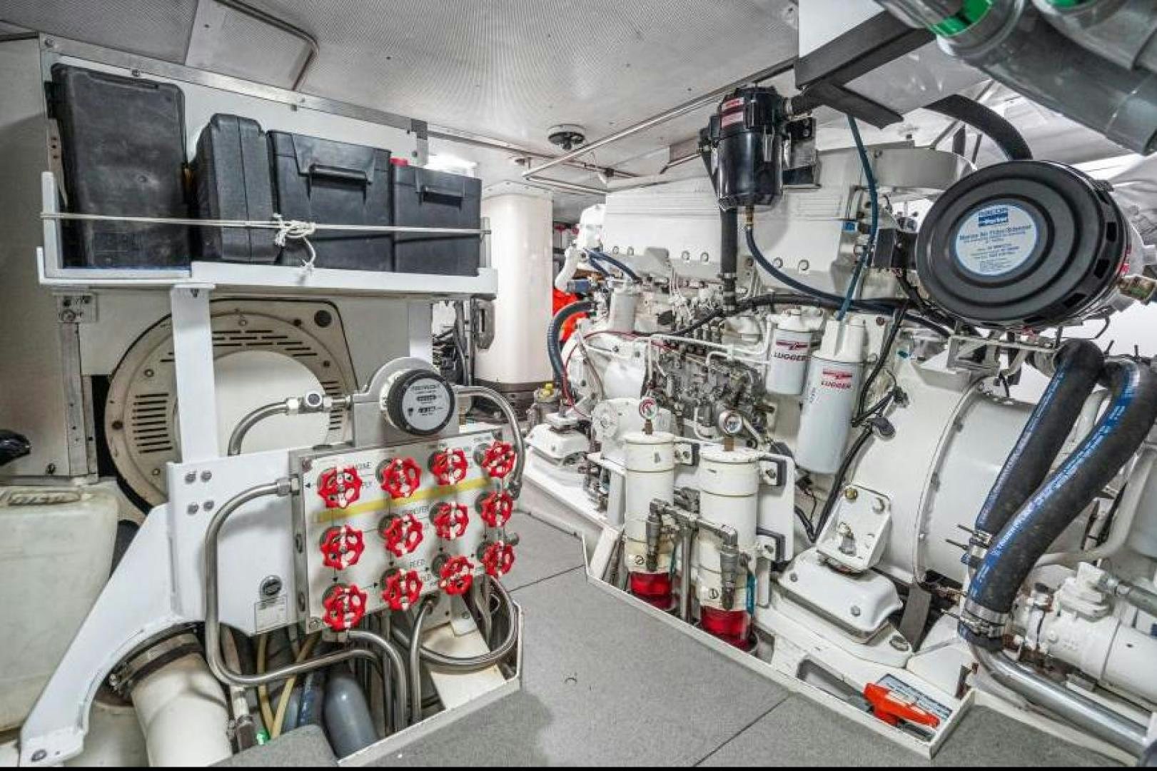 a white car with a large engine aboard PALIADOR Yacht for Sale