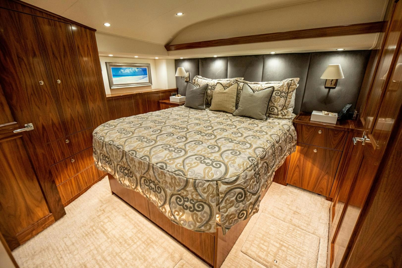 a large bed in a room aboard RAGIN CAJUN Yacht for Sale