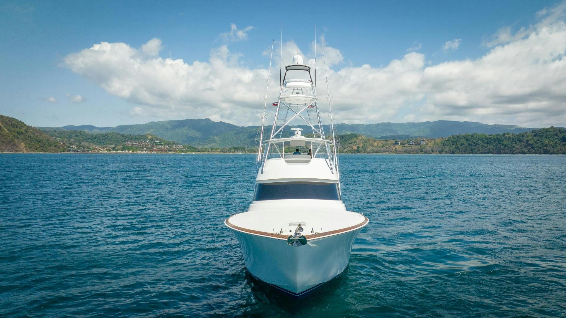 a white boat in the water aboard RAGIN CAJUN Yacht for Sale