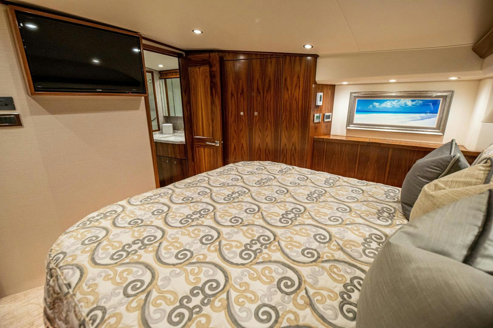 a large bed in a room aboard RAGIN CAJUN Yacht for Sale