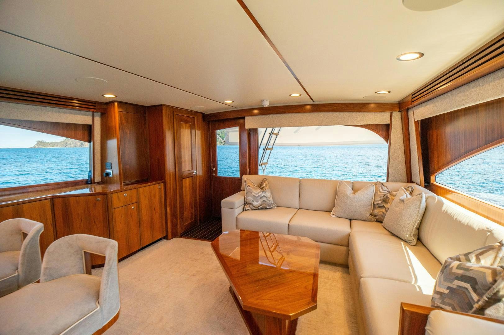 a living room with a large window aboard RAGIN CAJUN Yacht for Sale