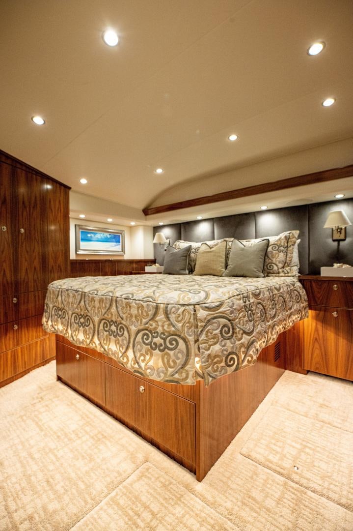 a bed with a large bed aboard RAGIN CAJUN Yacht for Sale