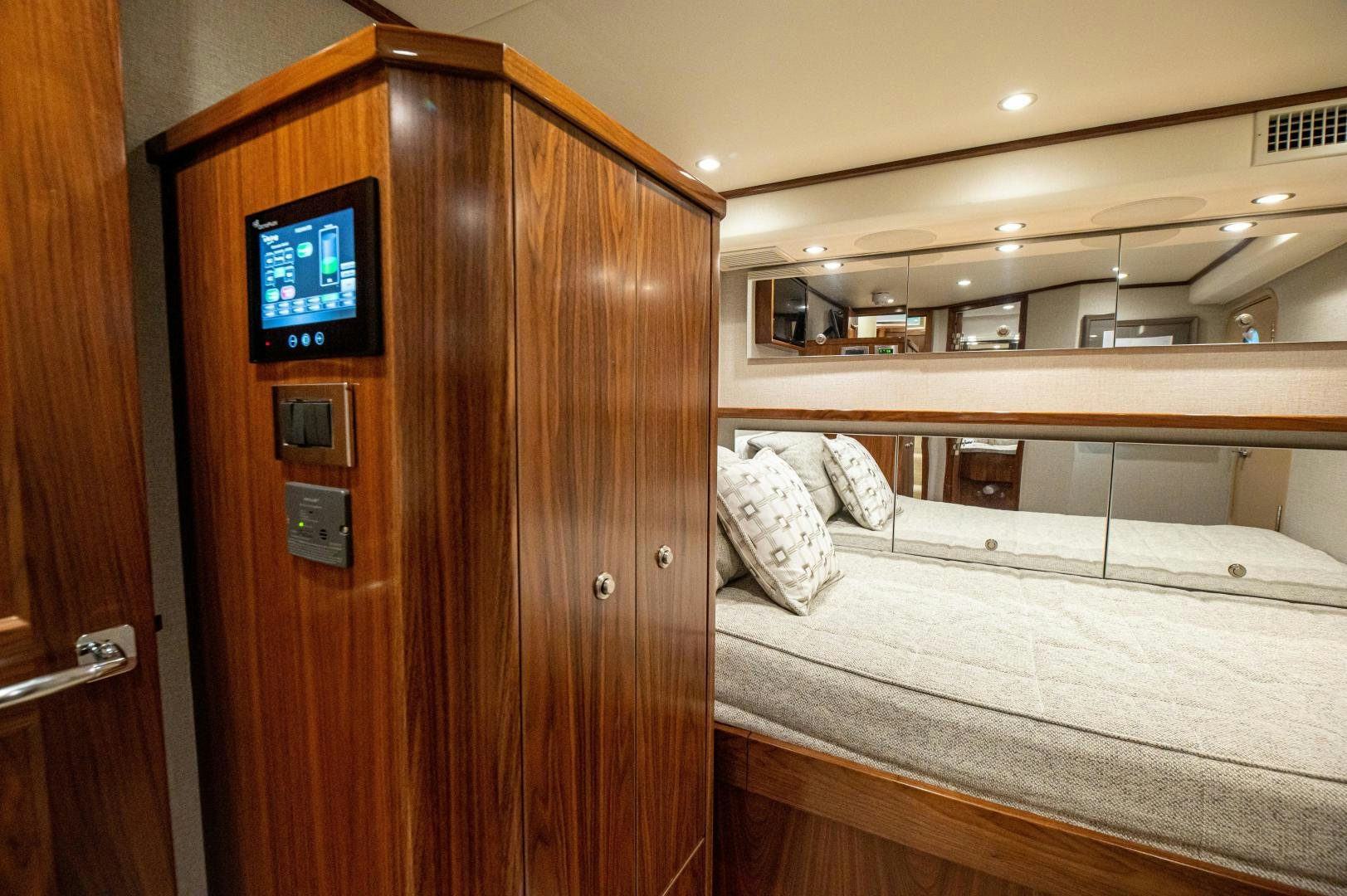 a room with a bed and a tv aboard RAGIN CAJUN Yacht for Sale