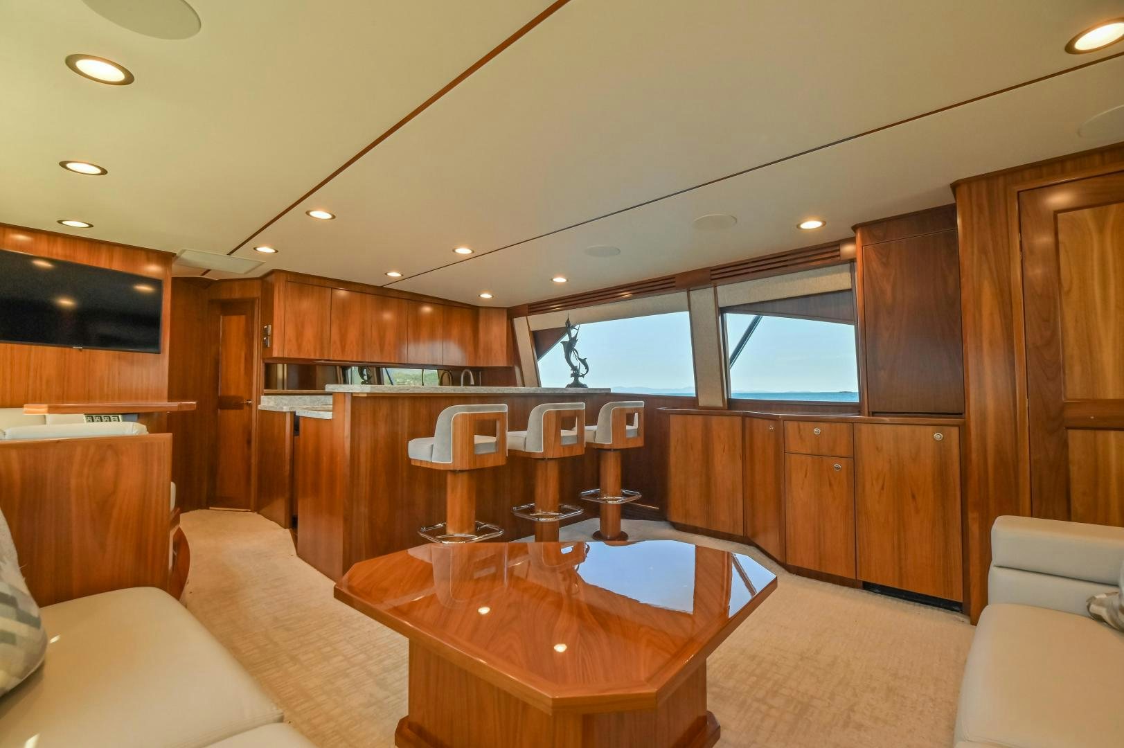 a large kitchen with wooden cabinets aboard RAGIN CAJUN Yacht for Sale